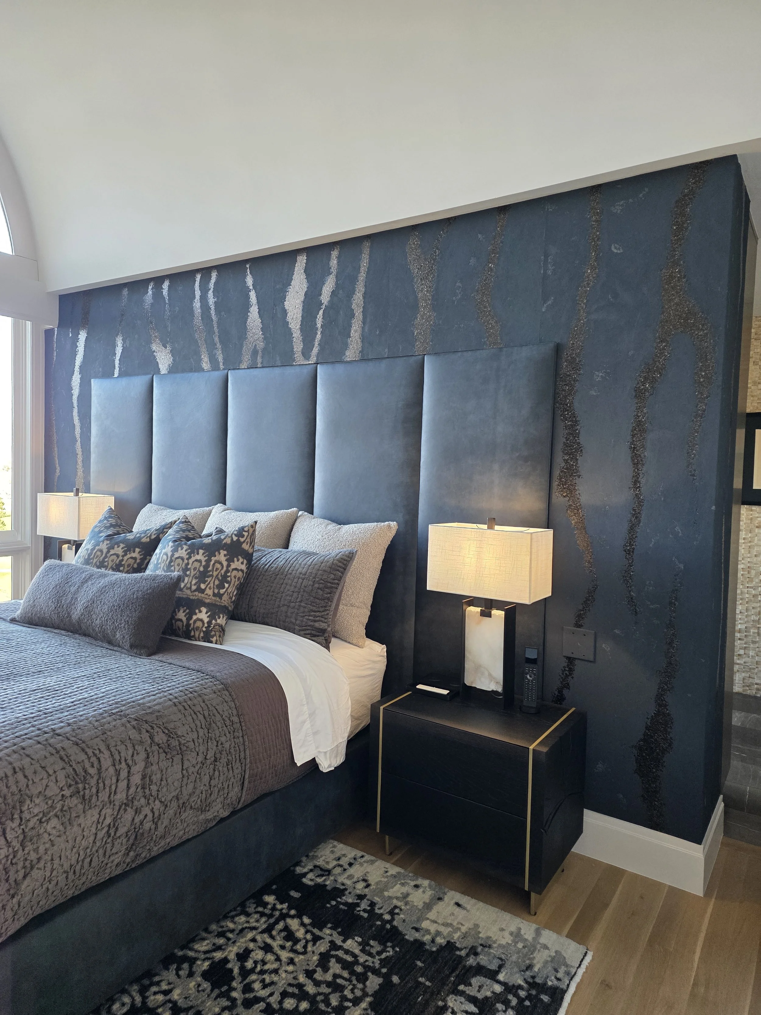 Phillip Jeffries wallcovering installed behind the bed in a Boulder primary bedroom.