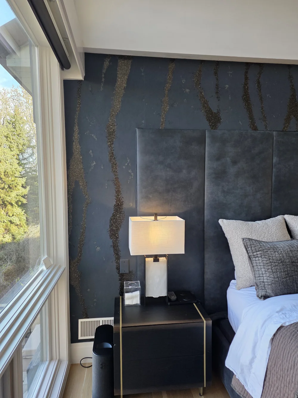 Phillip Jeffries wallpaper accent wall beside a bedroom window in Boulder, Colorado.