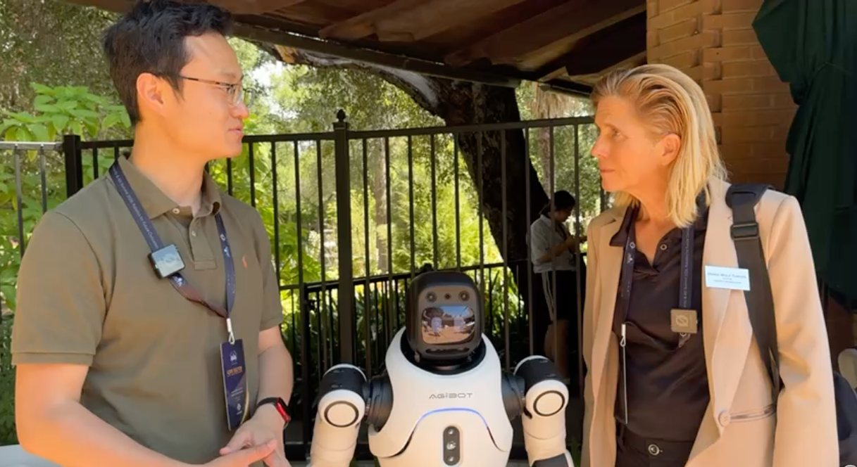 Diana Wolf Torres interviewing Peng Chen, AgiBot Business Development Director, at the AGI and Robotics Summit at Stanford University