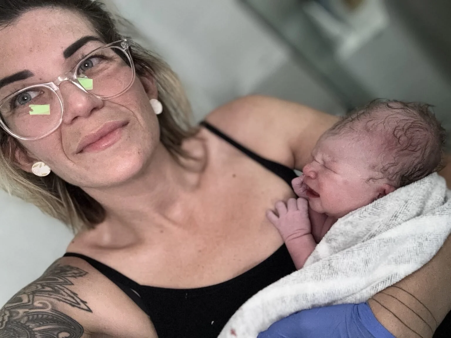 A mother meeting her baby in the first moments after birth