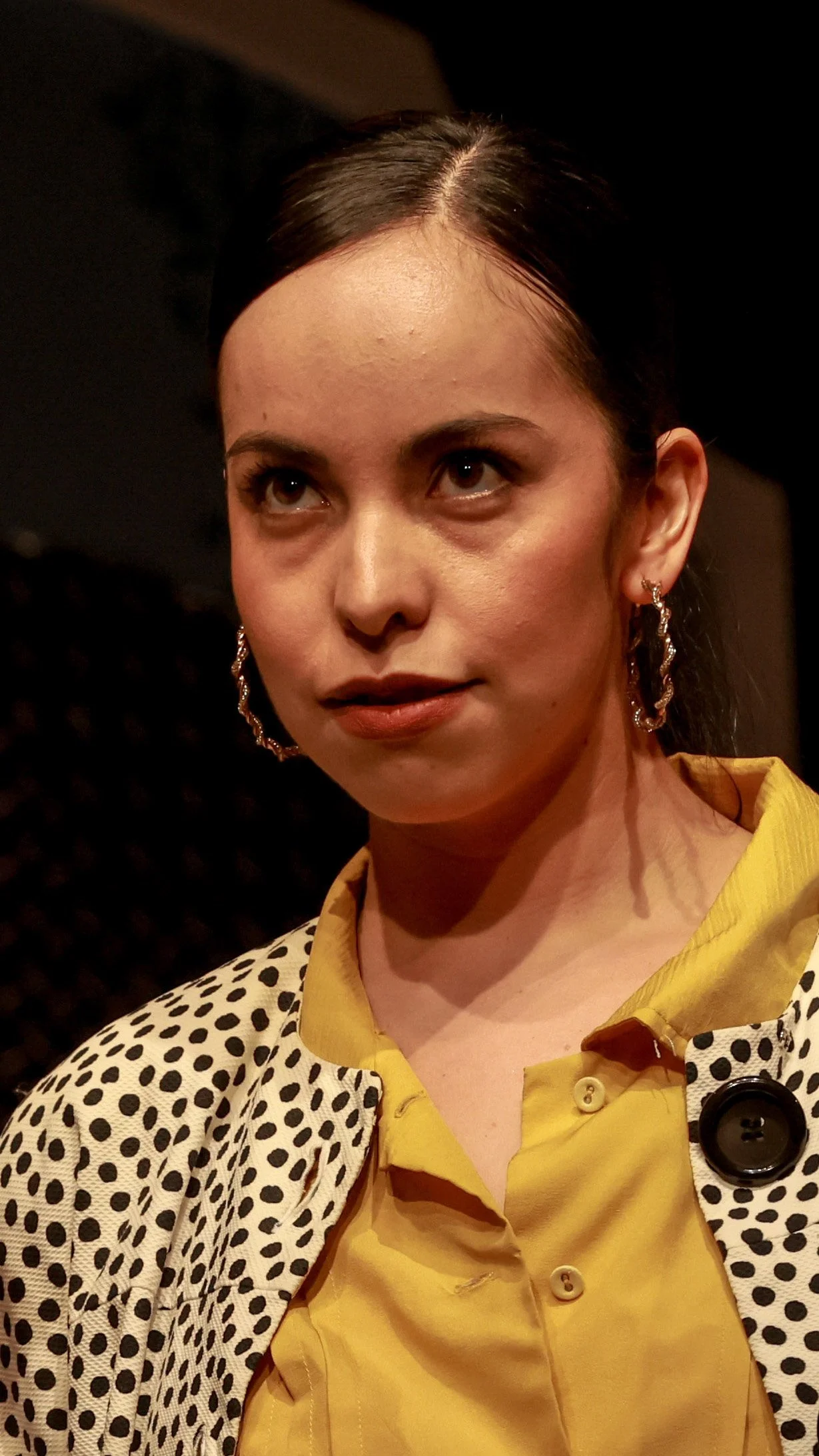 Close-up of a performer in a polka-dot cardigan in Molière’s The Imaginary Invalid.