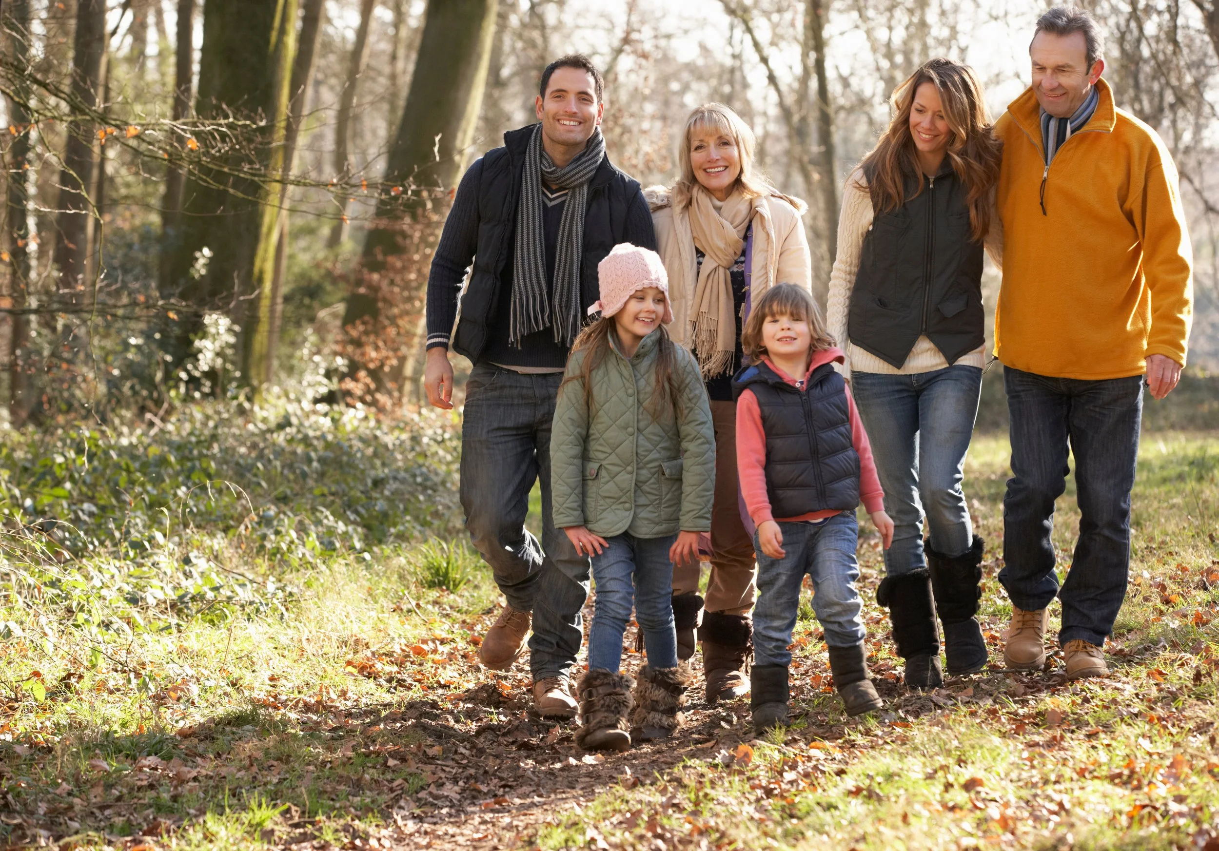 Family portrait session outdoors in a wooded setting