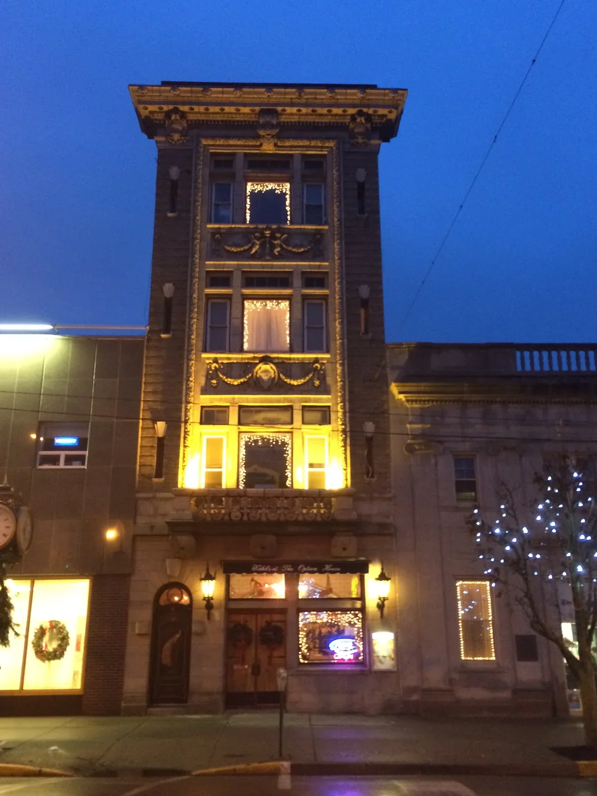 The Option House facade without a flag, illuminated at dusk in downtown Bradford, Pennsylvania