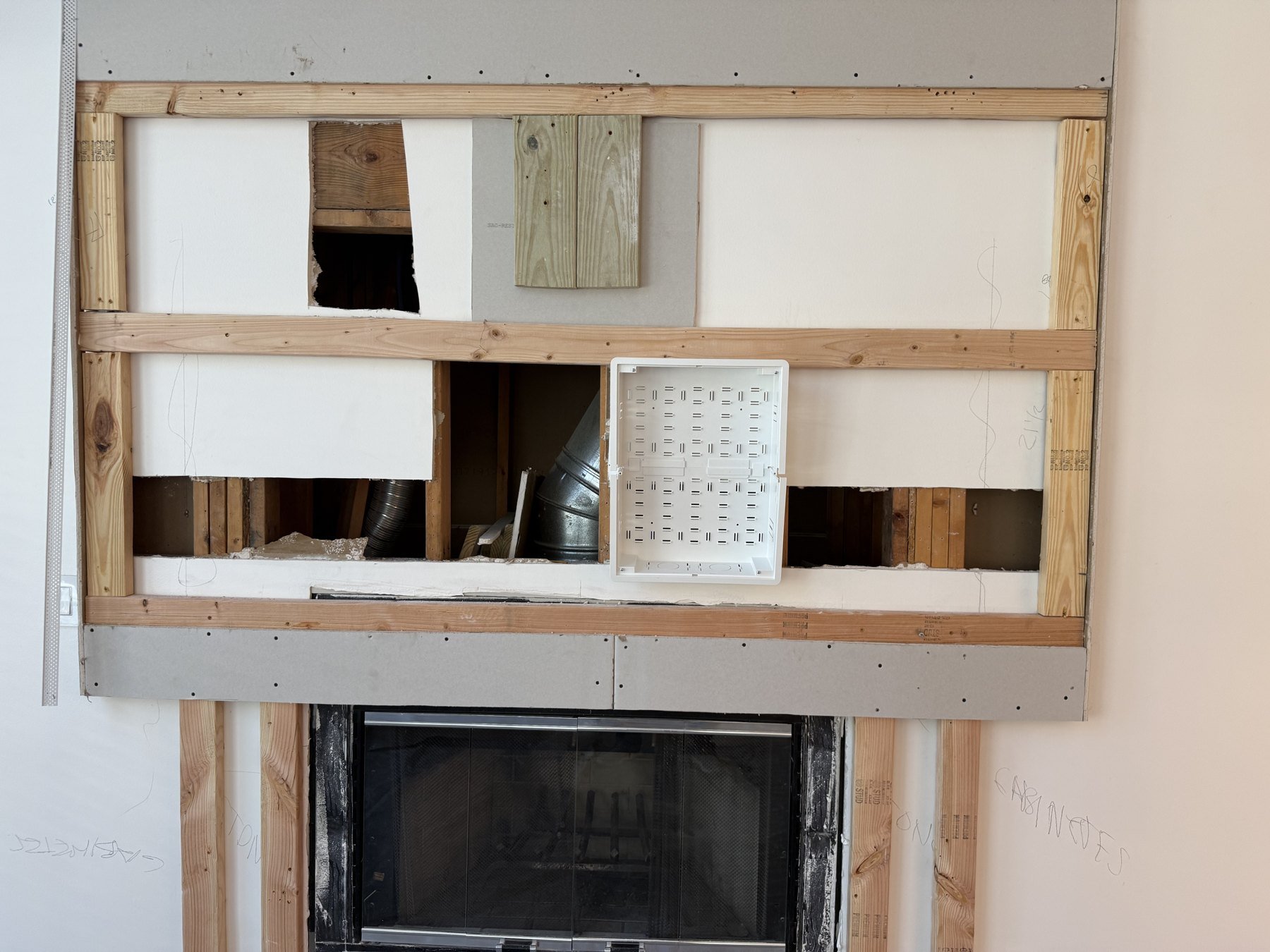 Installation progress: media-wall framing and infrastructure behind the display.