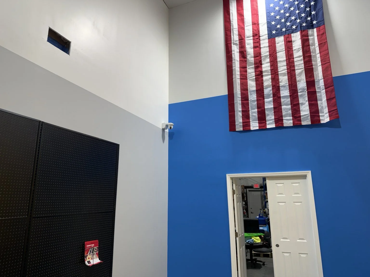 Installed security camera in a commercial retail and distribution facility