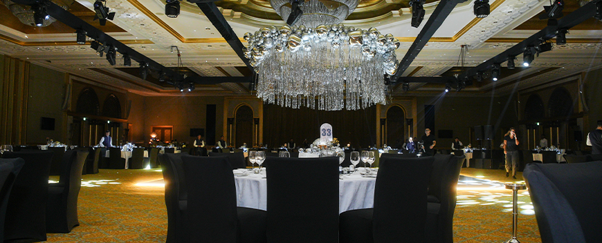 Wedding lighting at Emirates Palace Abu Dhabi — full ceiling rig with warm beam show and colour wash