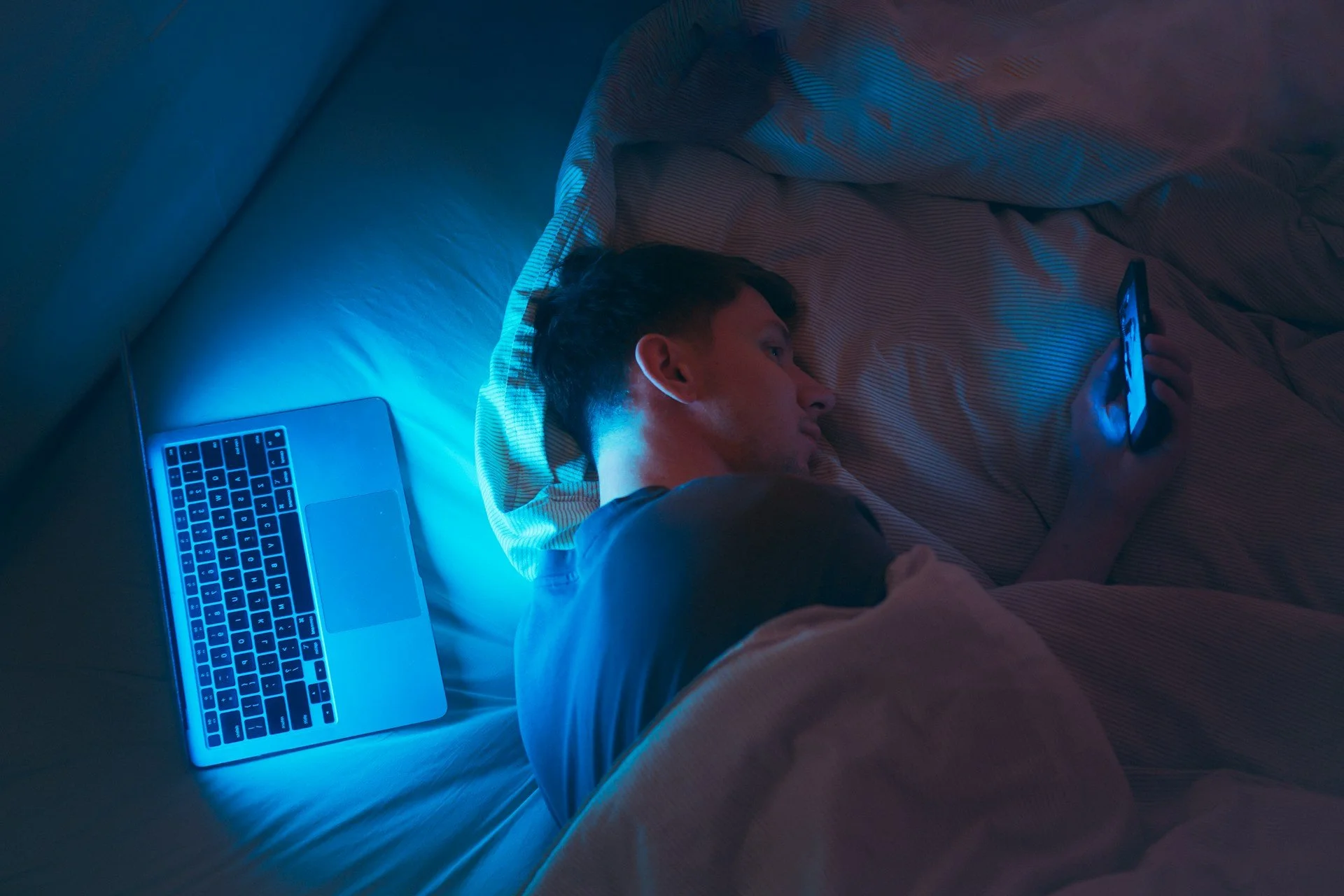 Man asleep at computer illustrating insomnia treatment at Good Day Mental Health Ogden Utah