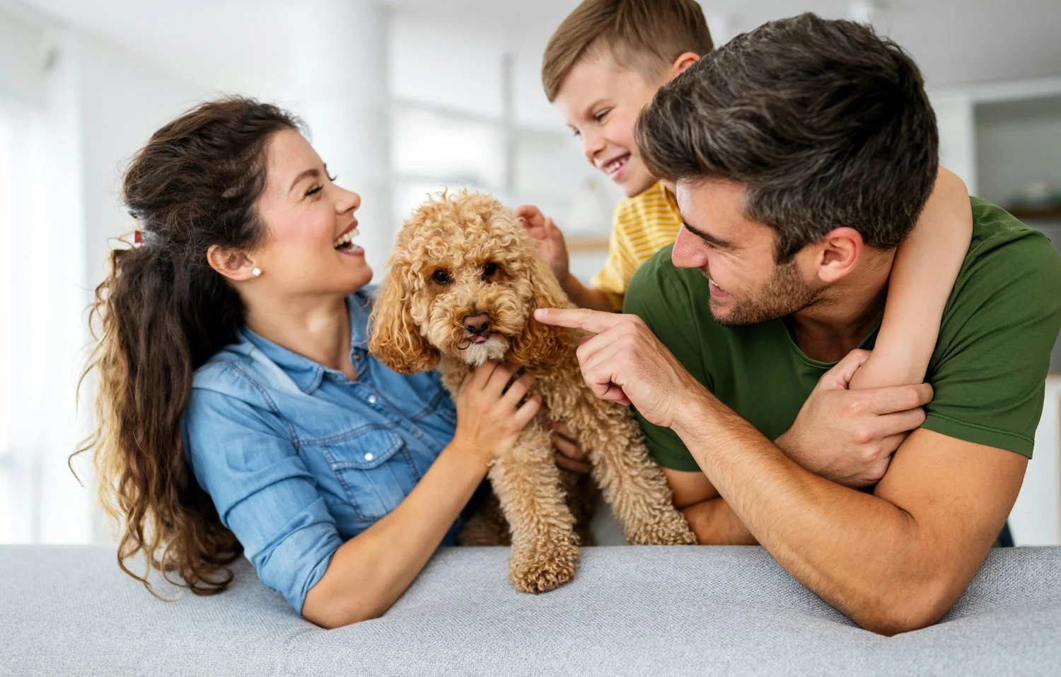 Family relaxed with their dog after cynophobia treatment at Good Day Mental Health in Ogden Utah