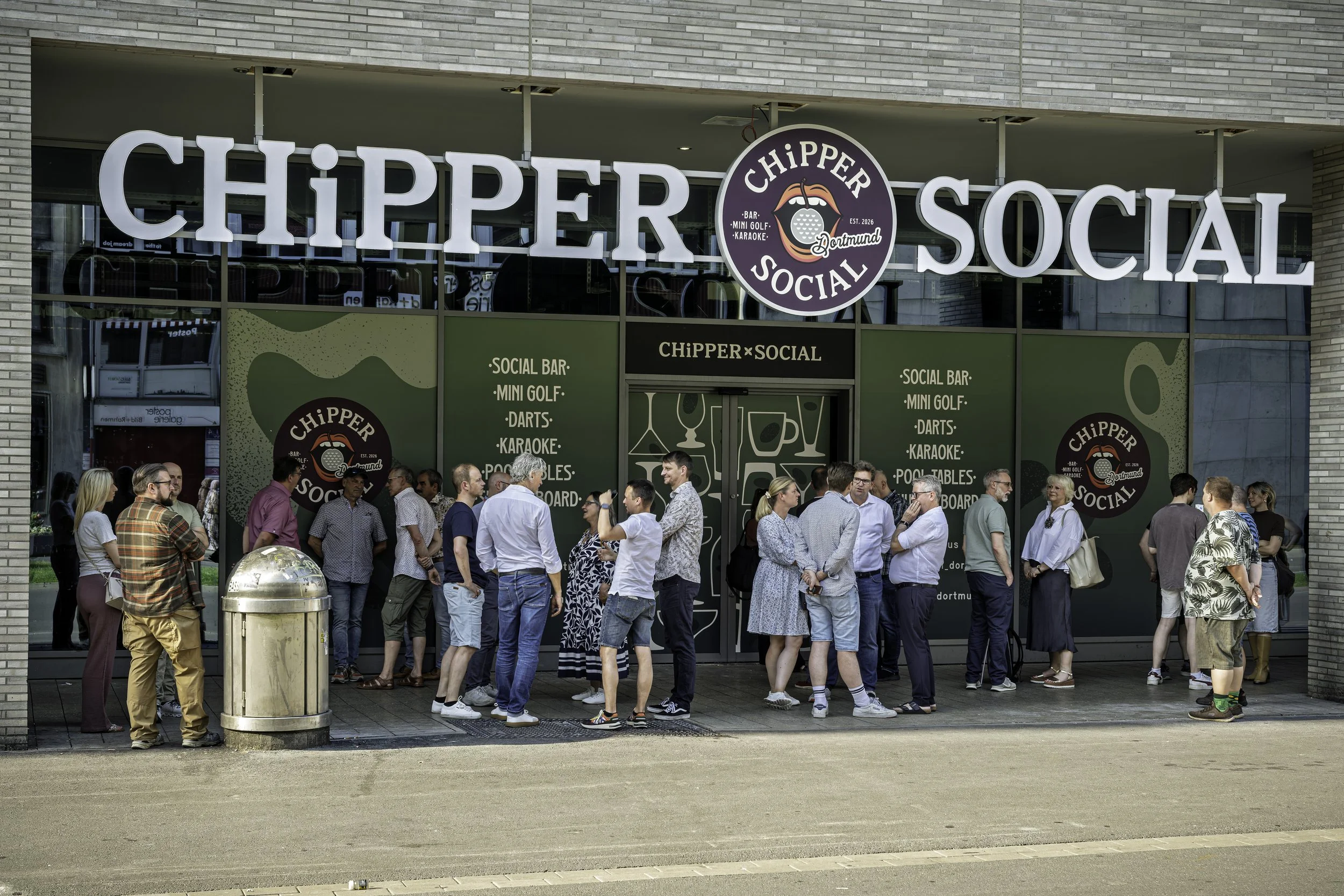 A large group gathered outside the Chipper Social Dortmund entrance