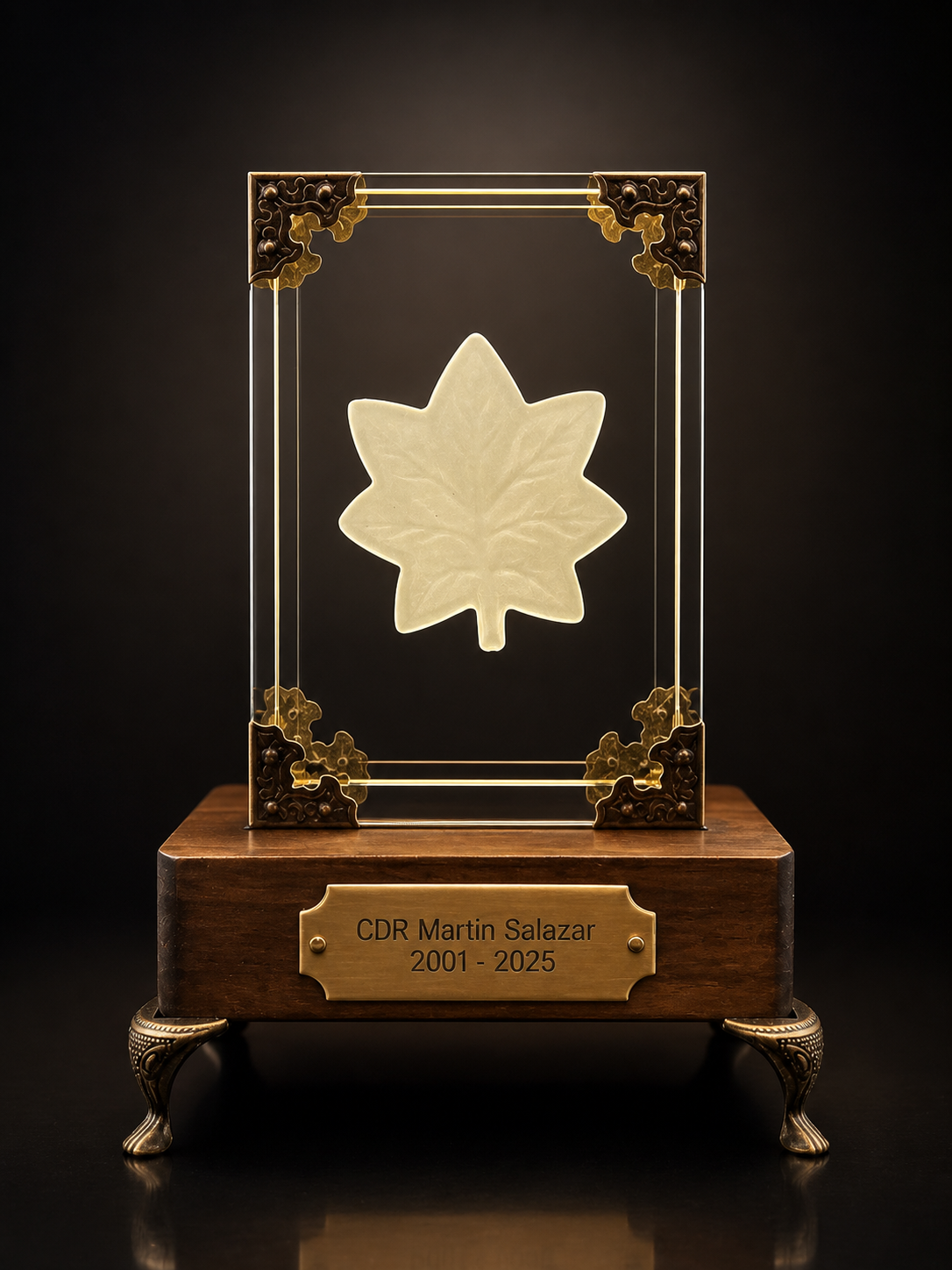 GhostGlass commander tribute monument with illuminated crystal, wood base, brass accents, and personalized nameplate.