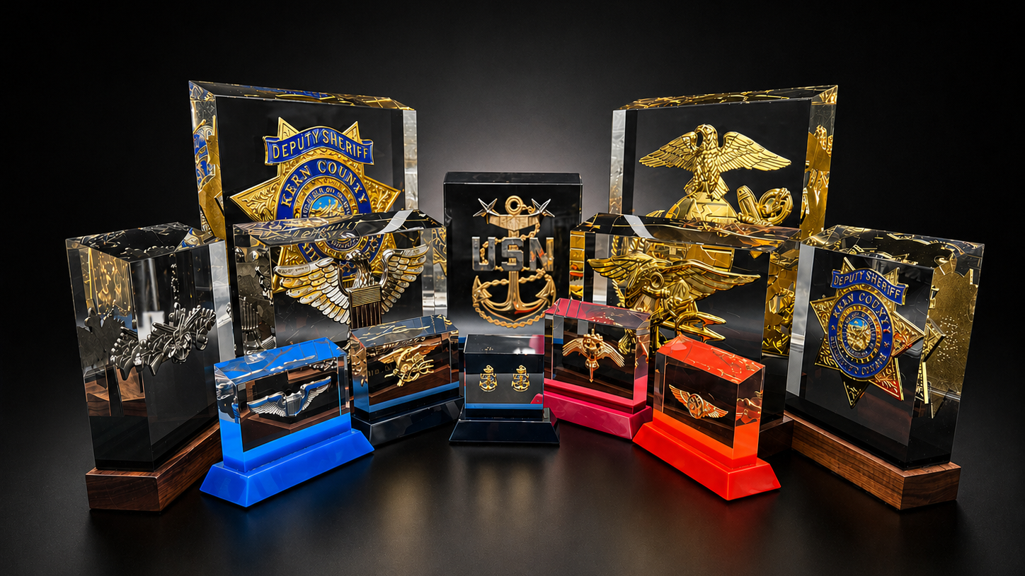 PromilleoGlass luxury glass monuments displayed together on a dark studio background.