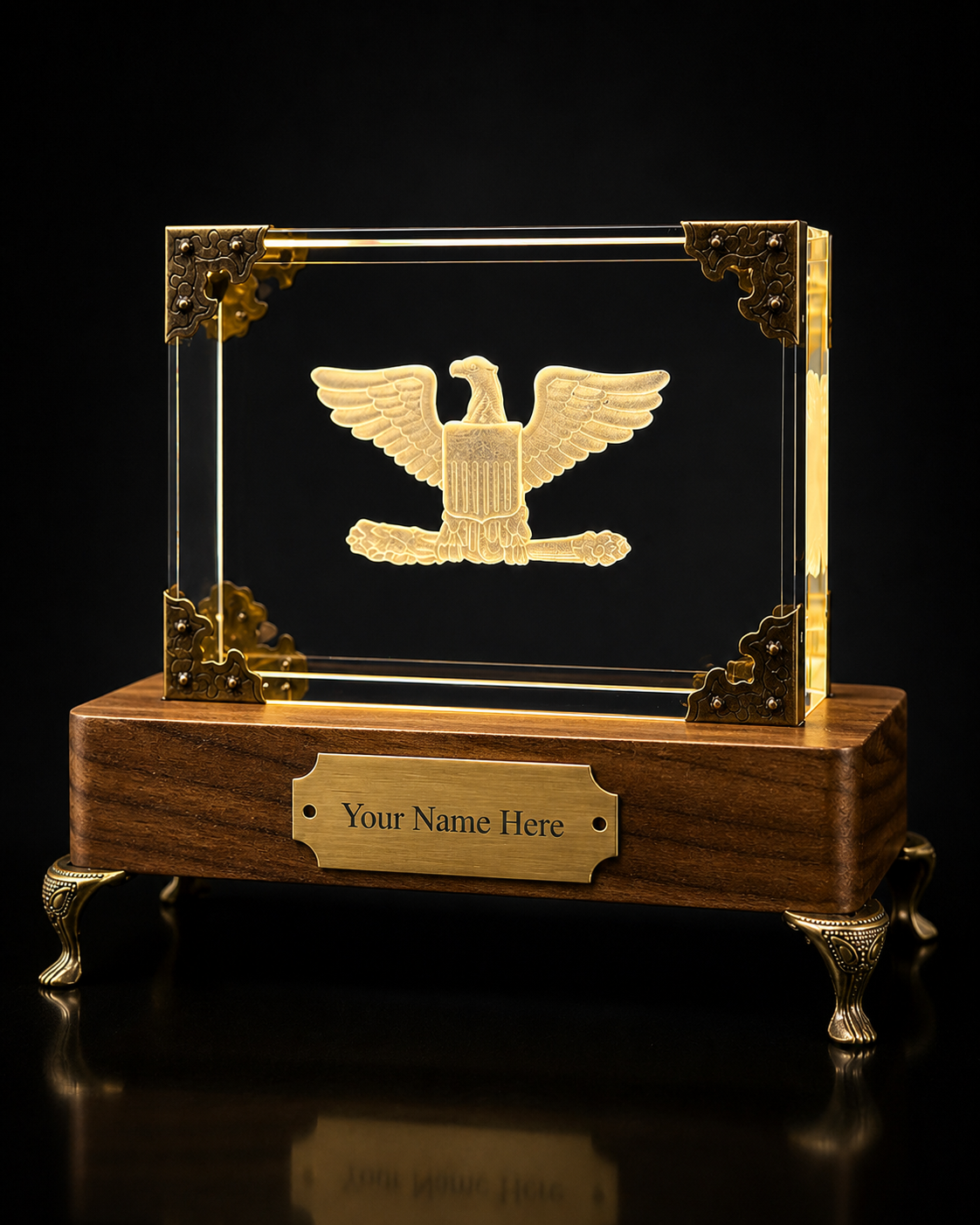 GhostGlass senior officer eagle tribute monument with illuminated crystal, wood base, brass corners, and nameplate.