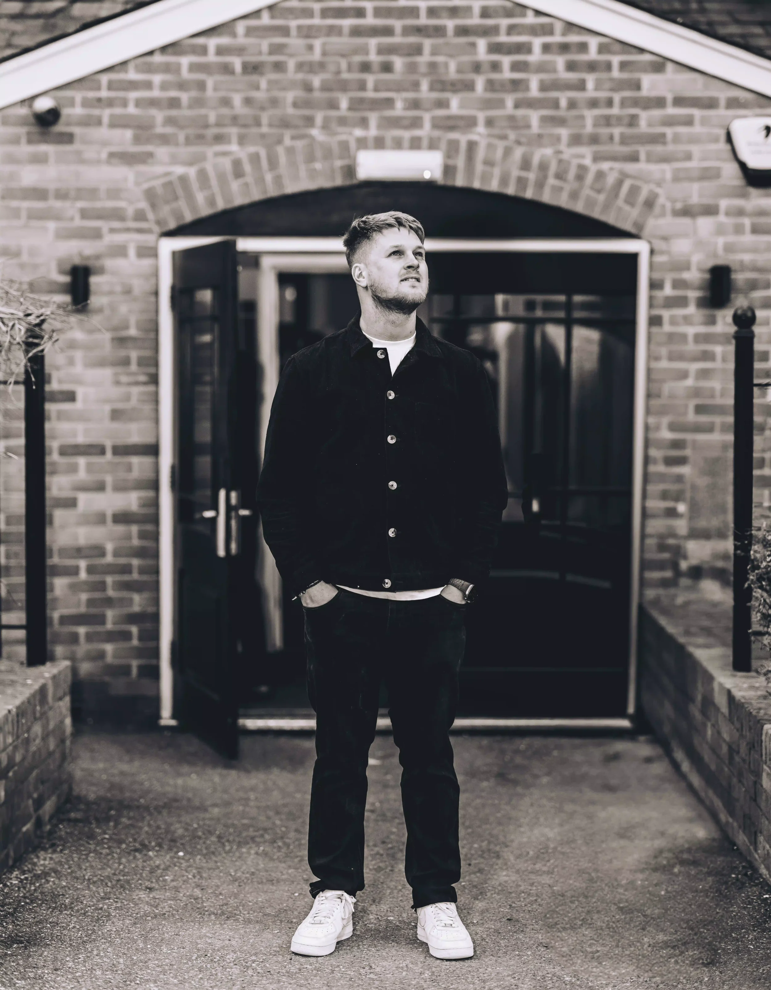Alex Green standing outside a brick building