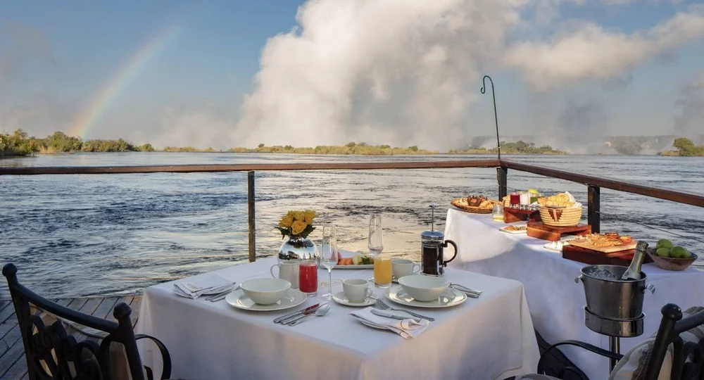 Breakfast on the jetty, with the mist of Victoria Falls beyond