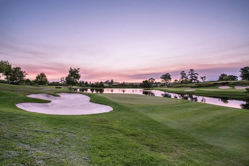 Fancourt Montagu at dusk, green beside the lake