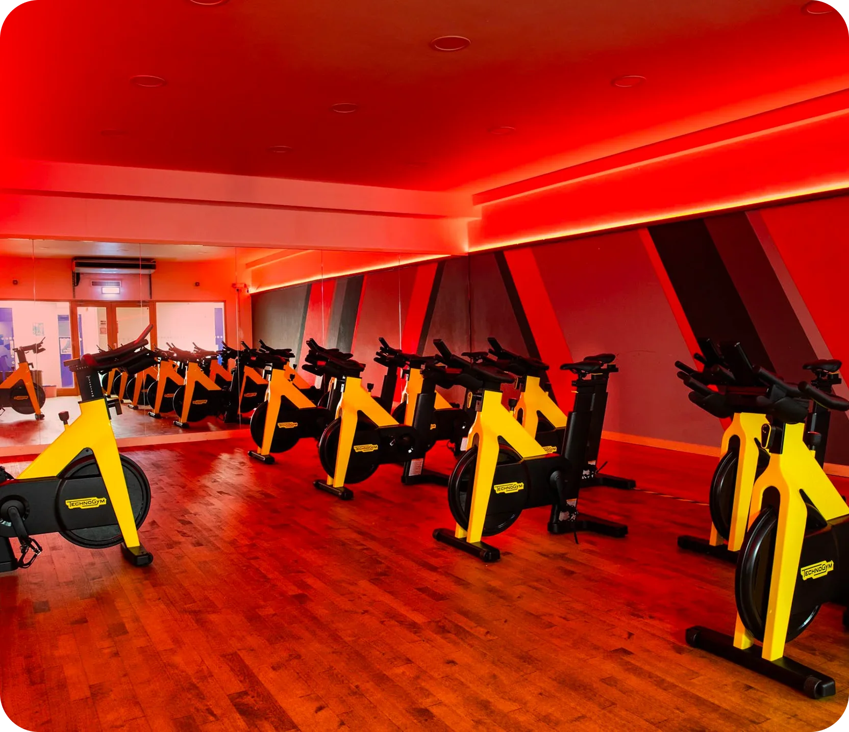 Empty spin studio with red lighting