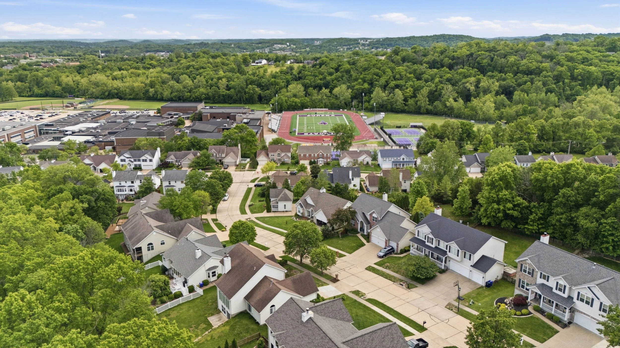 Aerial view of Wildwood MO tree canopy and homes, best realtor Wildwood MO