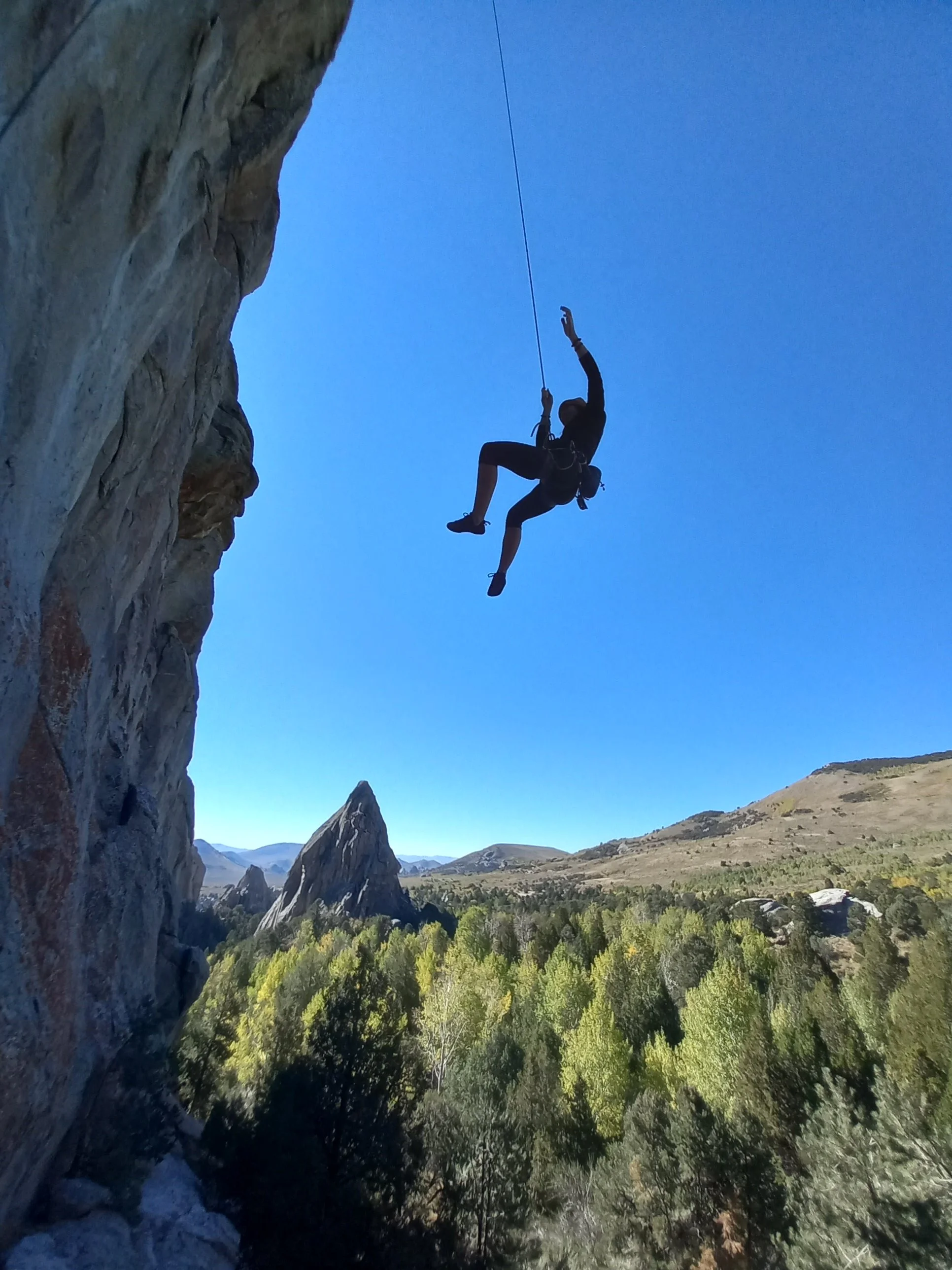 Founder Emily swinging out from the wall at City of Rocks National Reserve