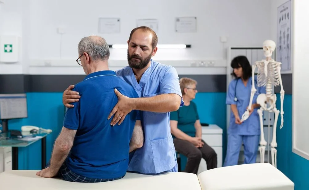 Chiropractor working with a client