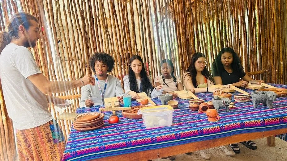 Guests at the Tierra Maya stone kitchen