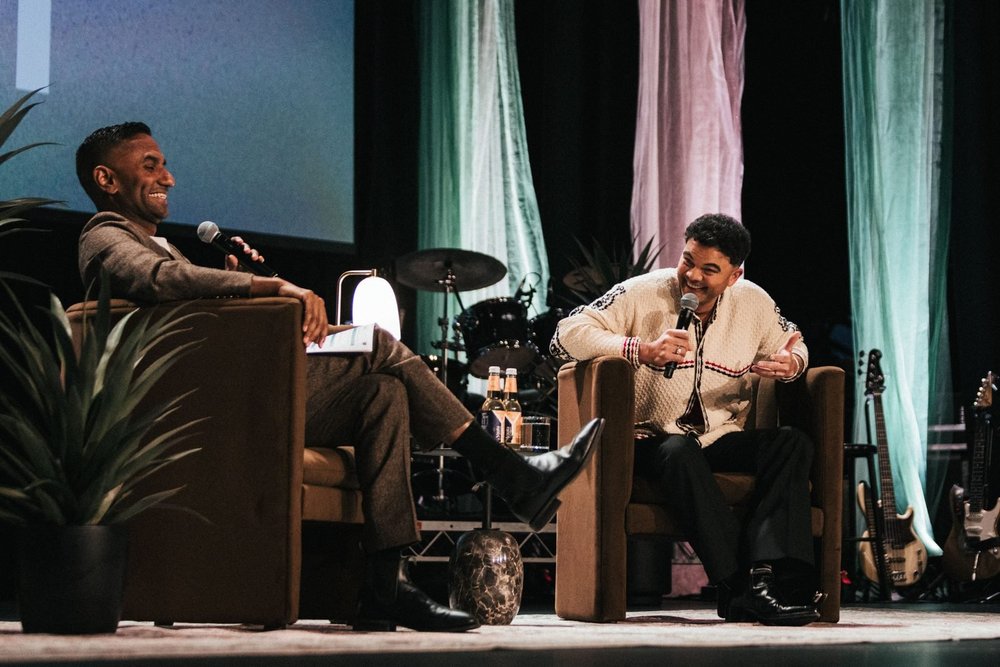 Two speakers in armchairs on the State Theatre stage