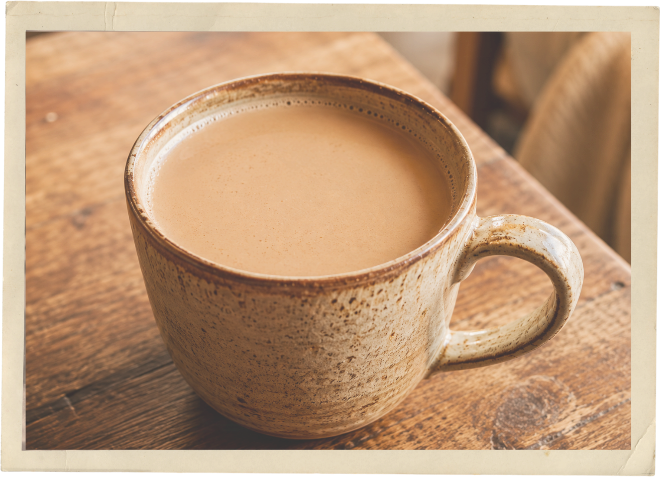 A warm Maple Latté in a rustic ceramic mug