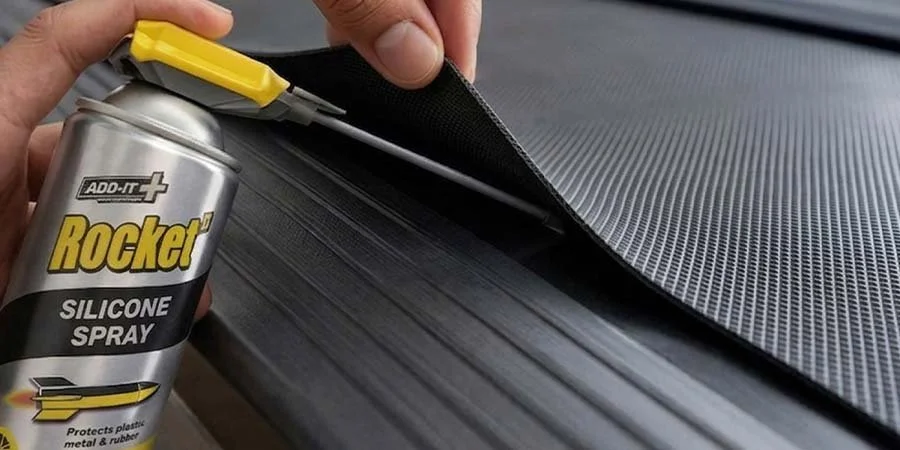 Rocket TT Silicone Spray Being Applied To Treadmill belt