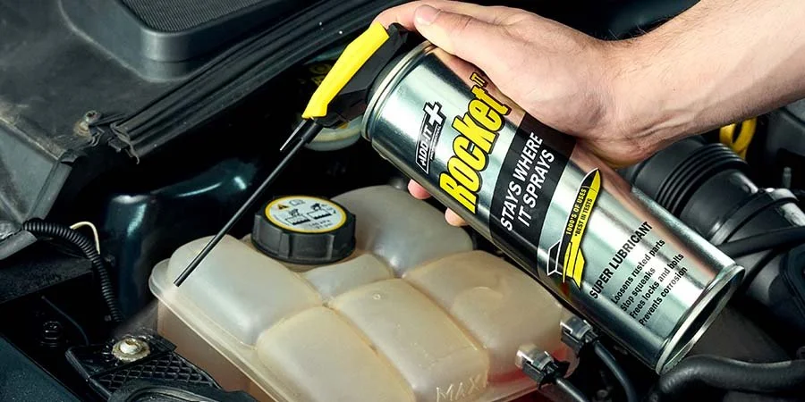 Rocket TT Super Lubricant Spraying Onto Nut In Car
