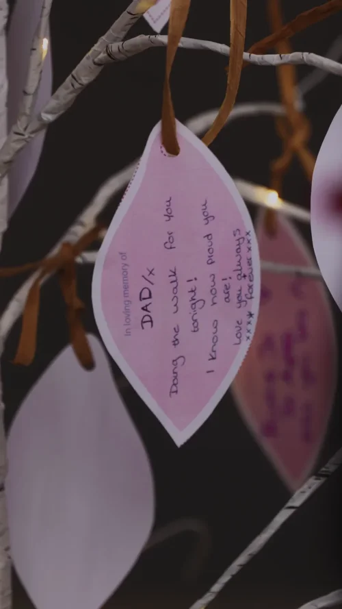 A handwritten message to Dad on a leaf hung on the memory tree
