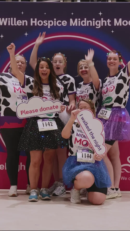 Leah, Jen and their team at the finish with Please donate signs
