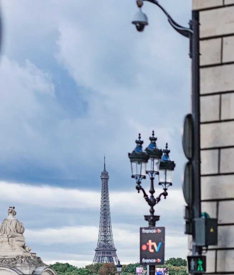 The Eiffel Tower beyond a Paris street lamp on the final day of the Tour de France 2026