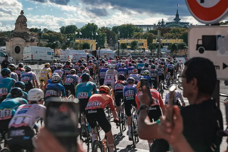 The peloton from behind riding into Place de la Concorde with the Grand Palais on the skyline, Tour de France 2026