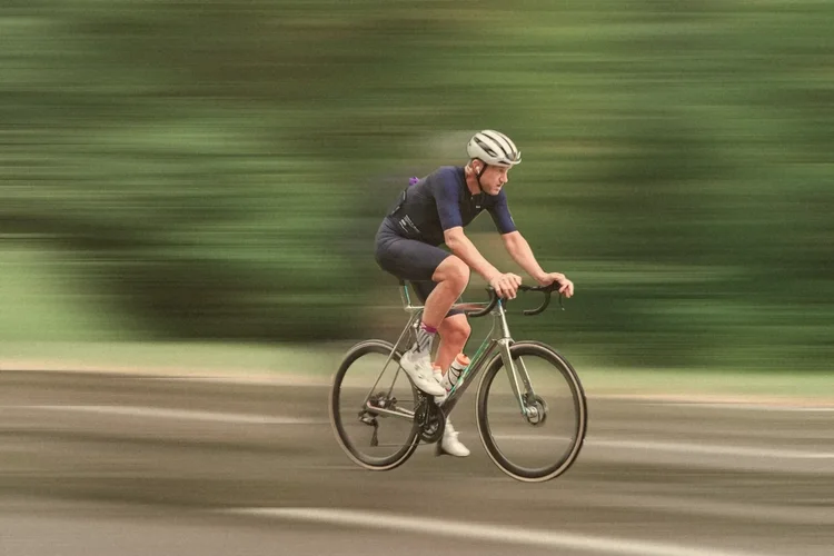 James at speed past a green blur of trees