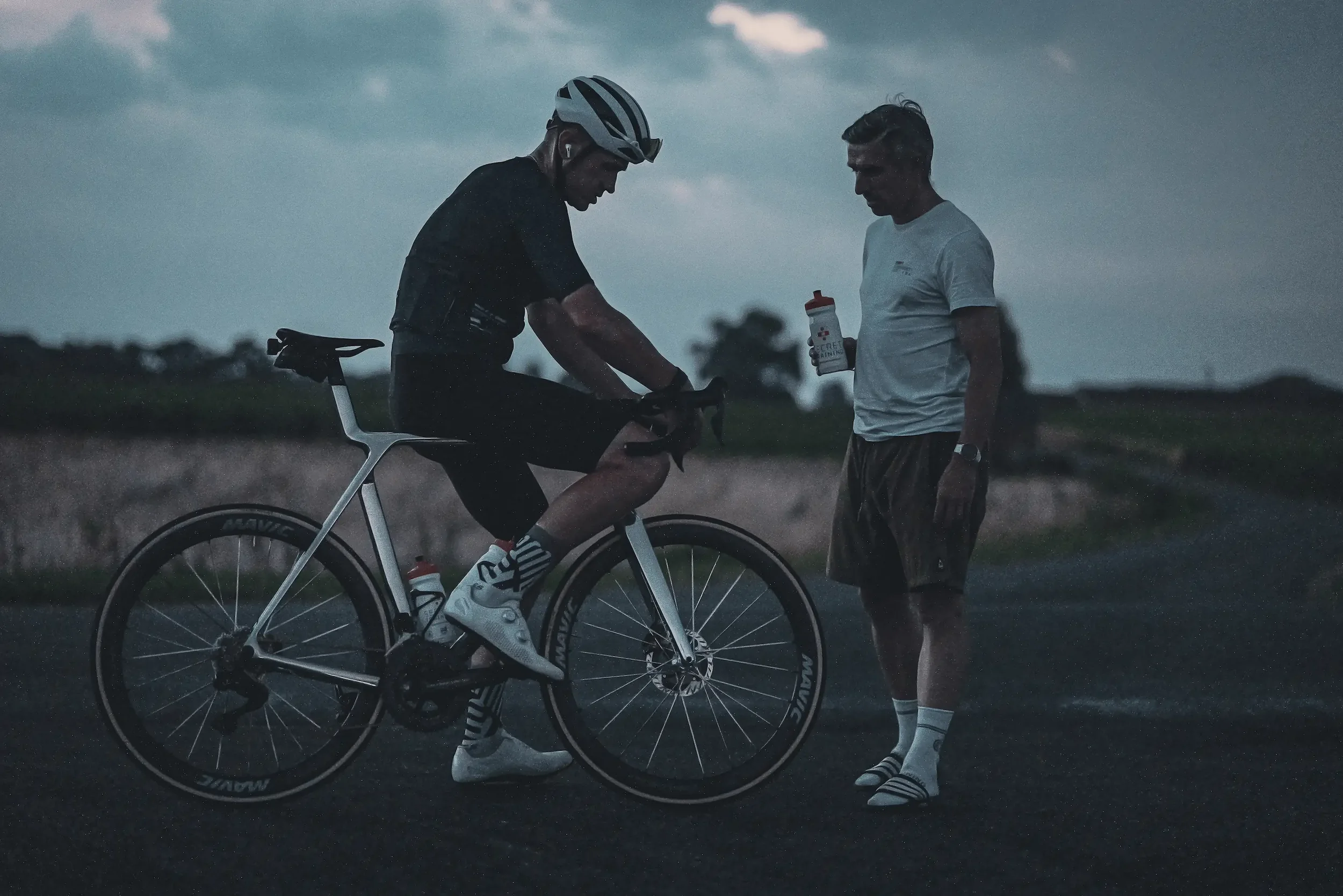 James Golding and Dean Downing at a night fuel stop during the 2112 Tour de France ride for GOSH