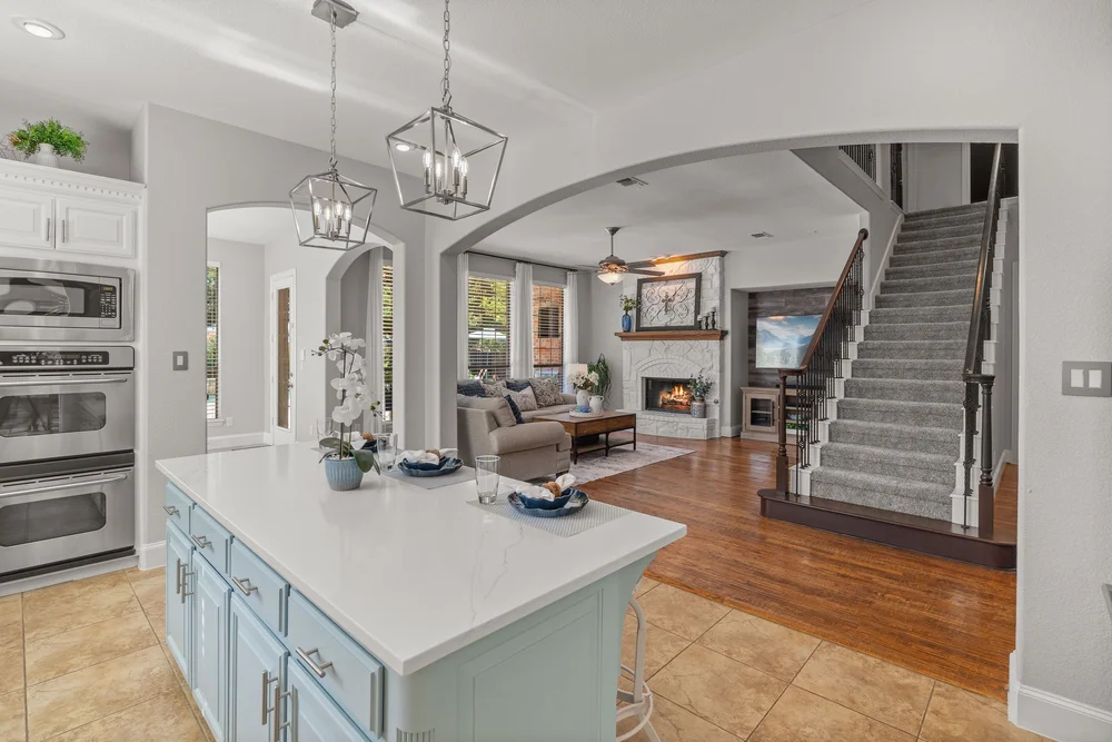 Open kitchen island with views of the staircase and family room