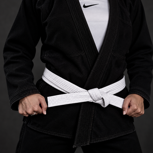 Black BJJ gi and white belt, with face out of frame