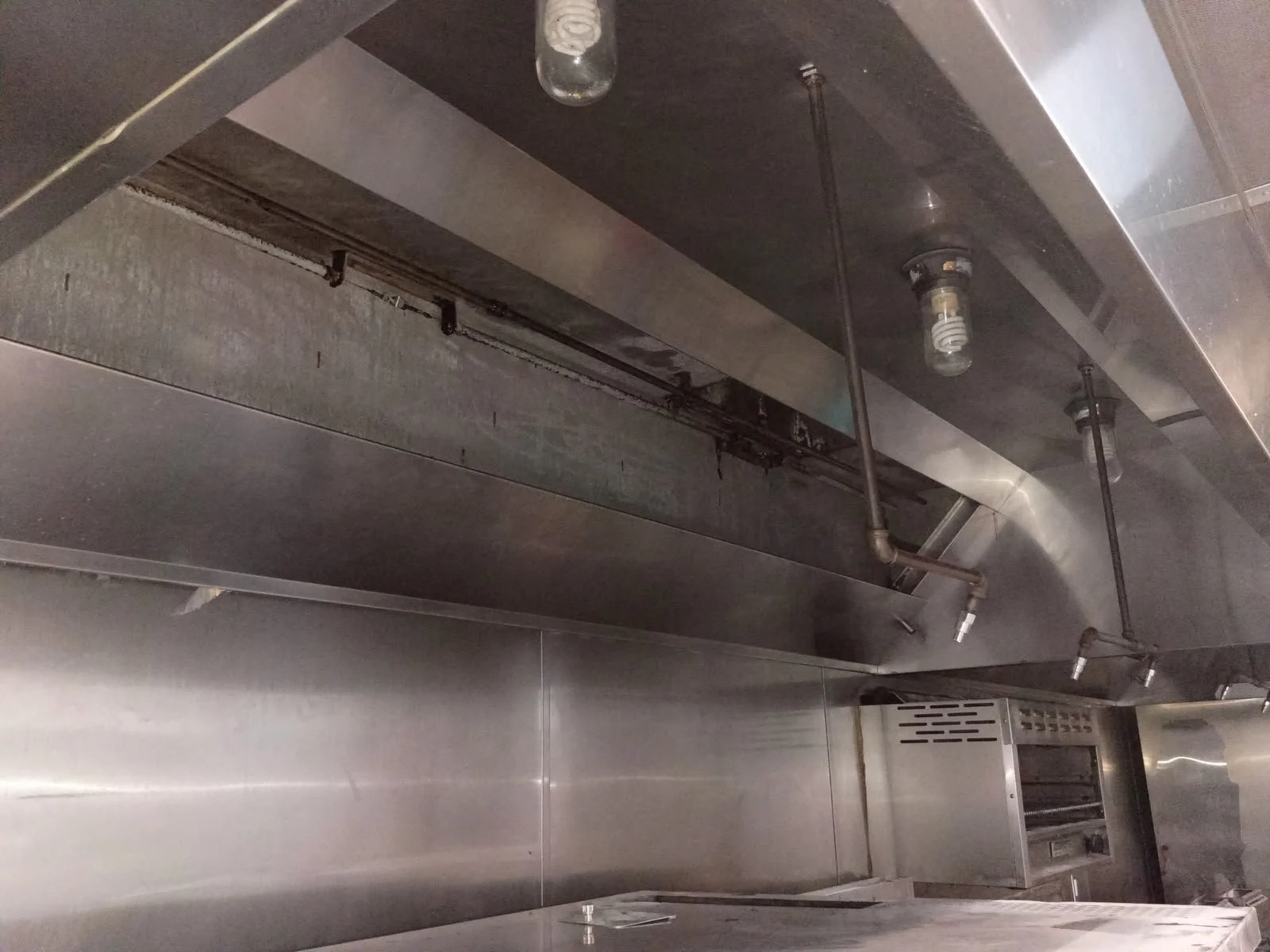 Commercial kitchen stainless steel hood and appliances