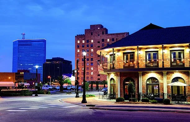 Downtown Lake Charles commercial buildings at dusk