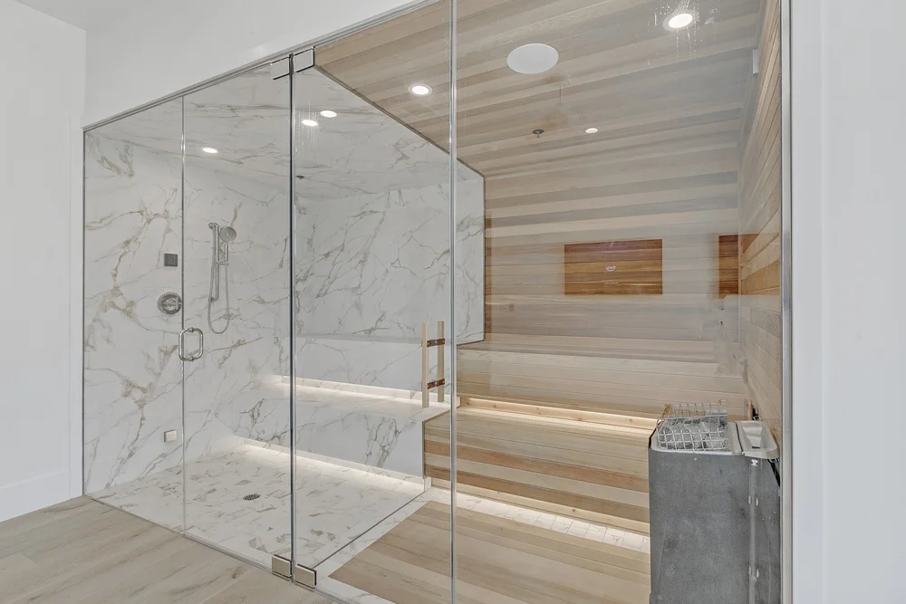 Frameless glass shower enclosure with clear panels