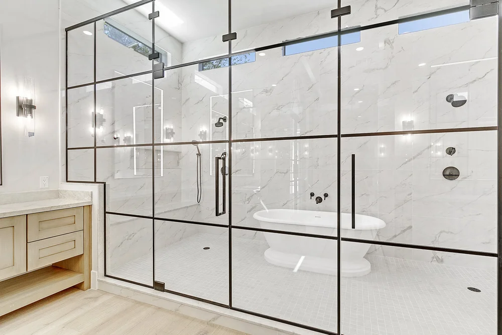 Custom glass shower door with modern hardware
