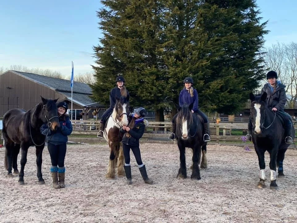 Young rider enjoying a lesson at Carrington Riding Centre