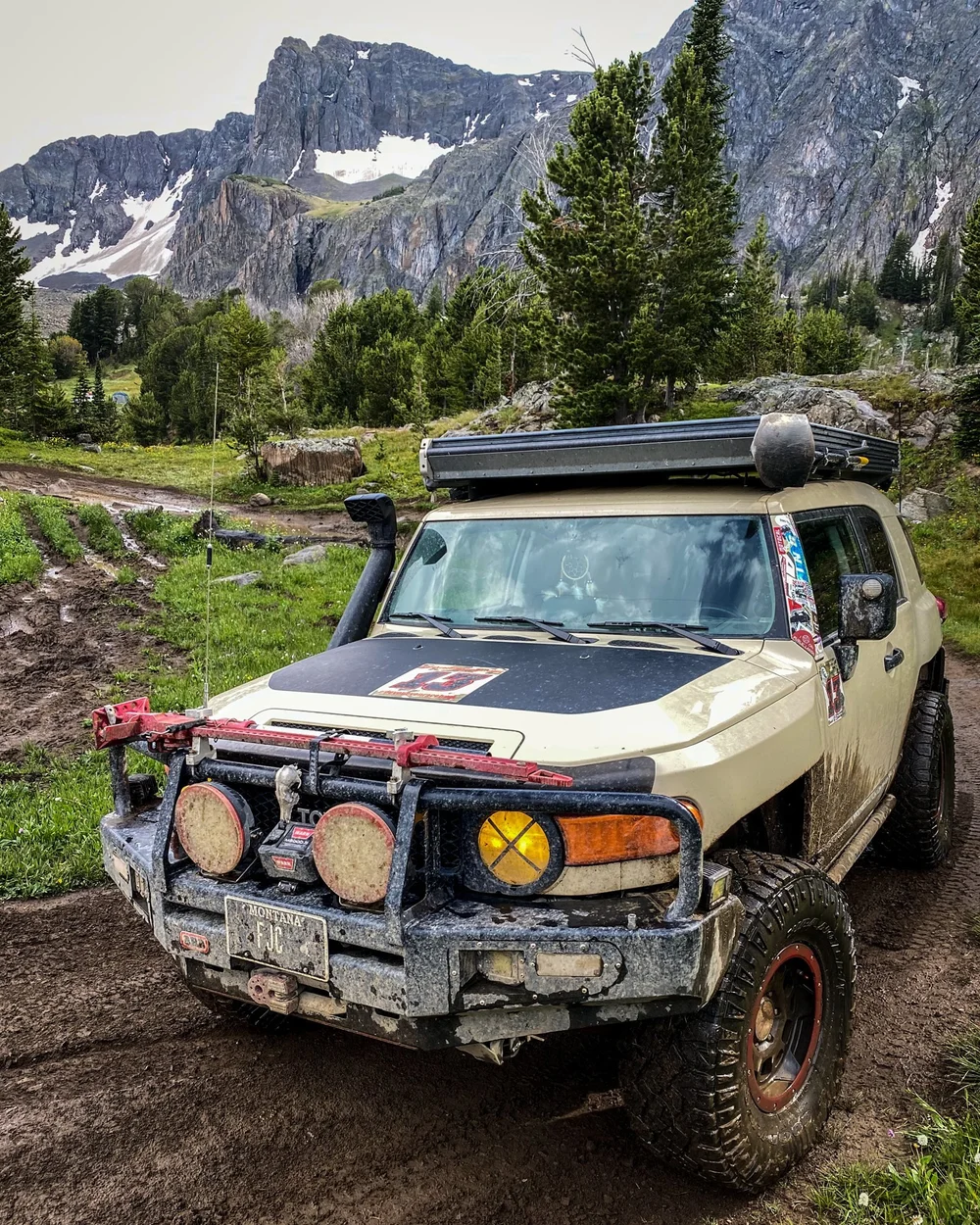 FJ Cruiser on a rocky track with jagged peaks behind