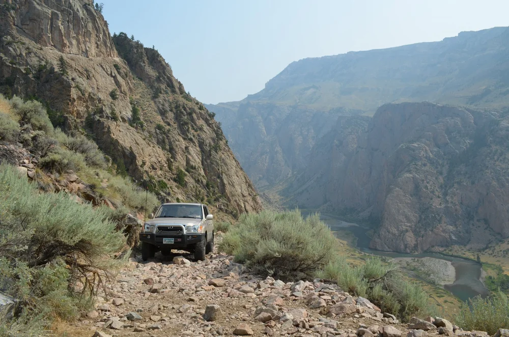 Pickup on a rocky shelf high above Clarks Fork Canyon