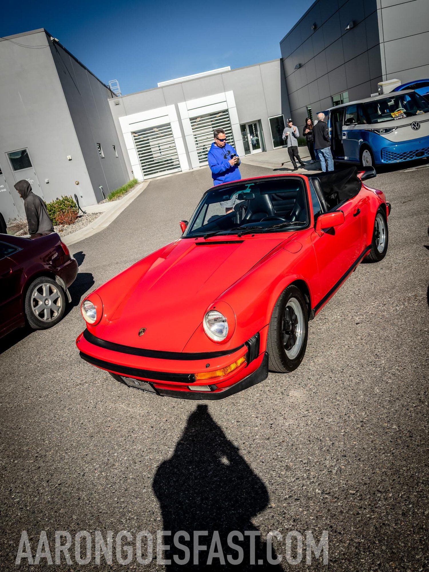 Red Porsche 911 cabriolet with the top down