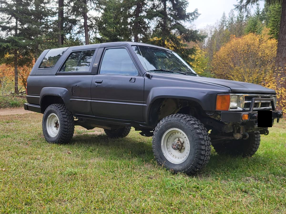 Flat black 1985 Toyota 4Runner with white steel wheels in Valley, Washington