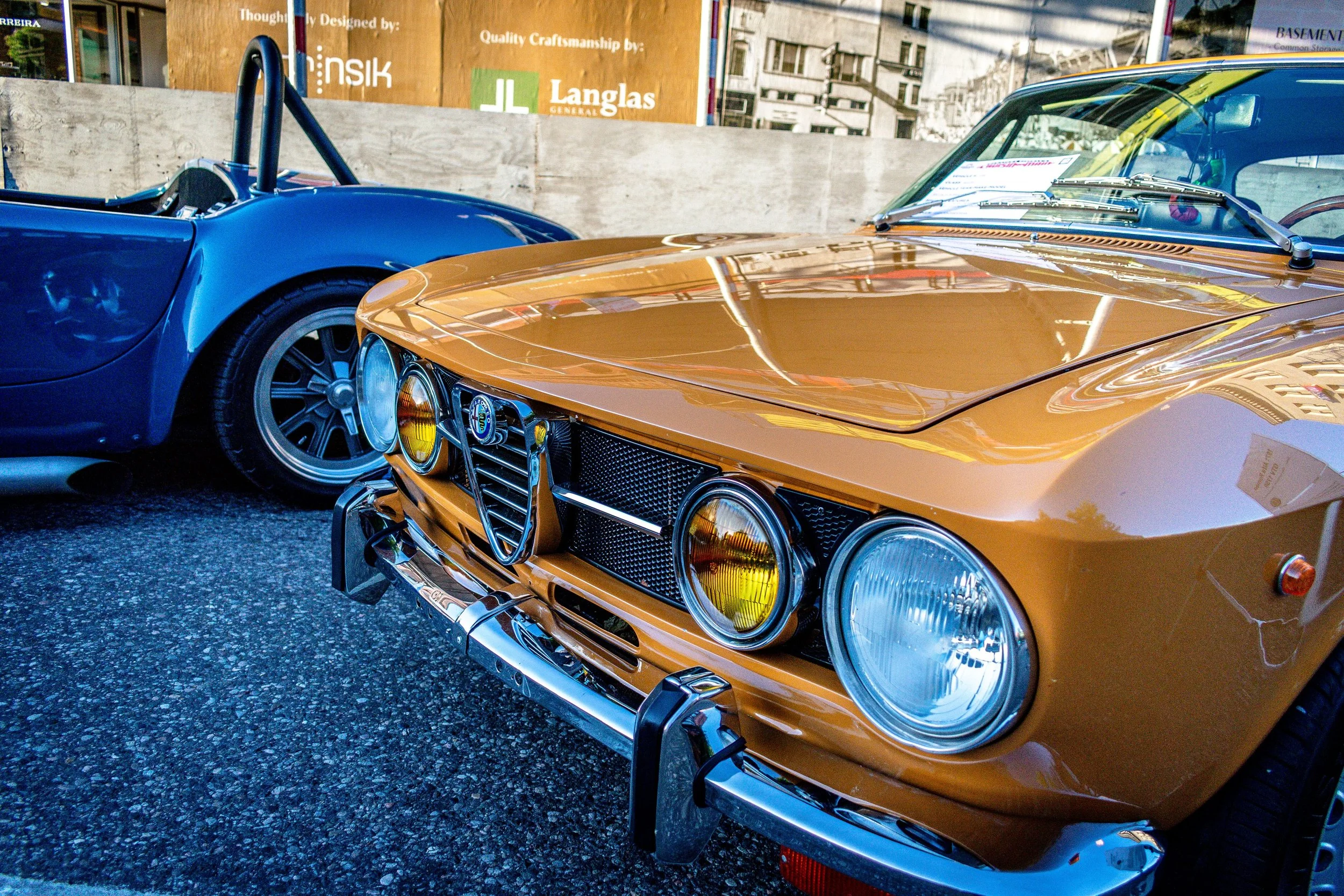 Close-up of the Alfa Romeo GTV's quad round headlights, grille, and Alfa Romeo shield badge