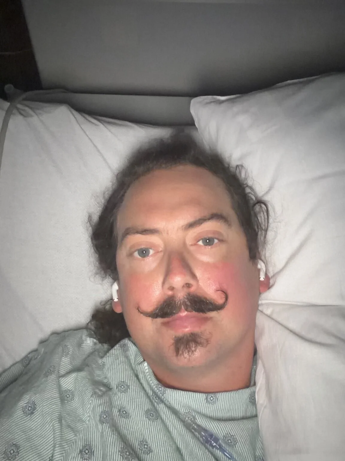 Aaron recovering in the hospital after surgery