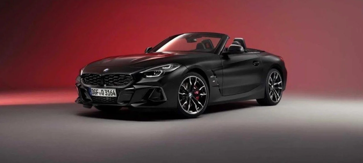 Frozen Matt Black BMW Z4 Final Edition roadster with its top down in a studio