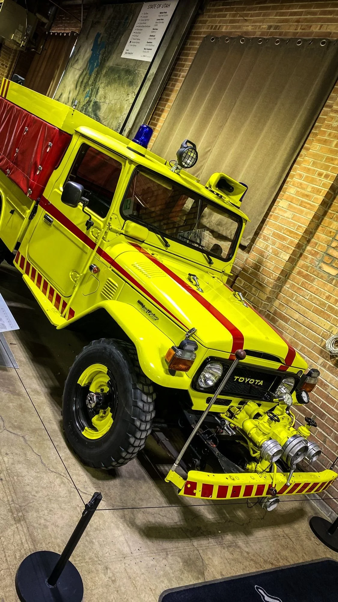 Bright yellow Land Cruiser fire-rescue truck on display in the Land Cruiser Heritage Museum