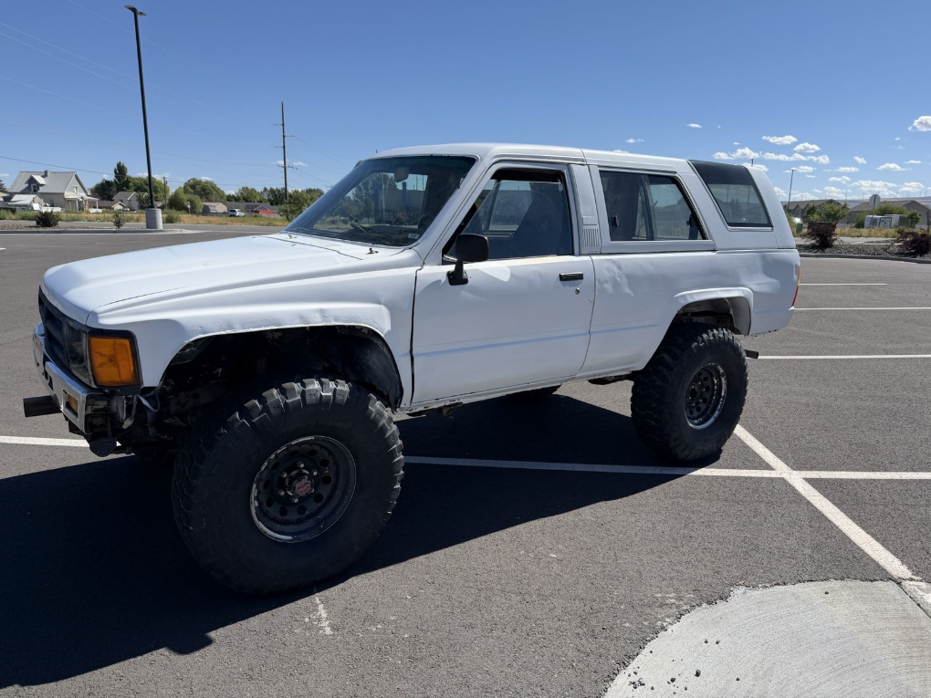 White 1985 Toyota 4Runner on 35-inch tires in an Idaho Falls parking lot